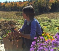 Heather McCargo holding some native wildflowers